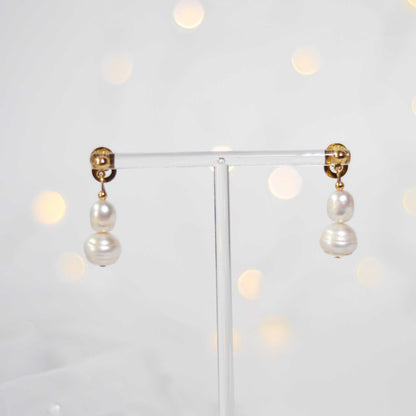 White oval and siopao dangling pearls yellow gold plated earrings