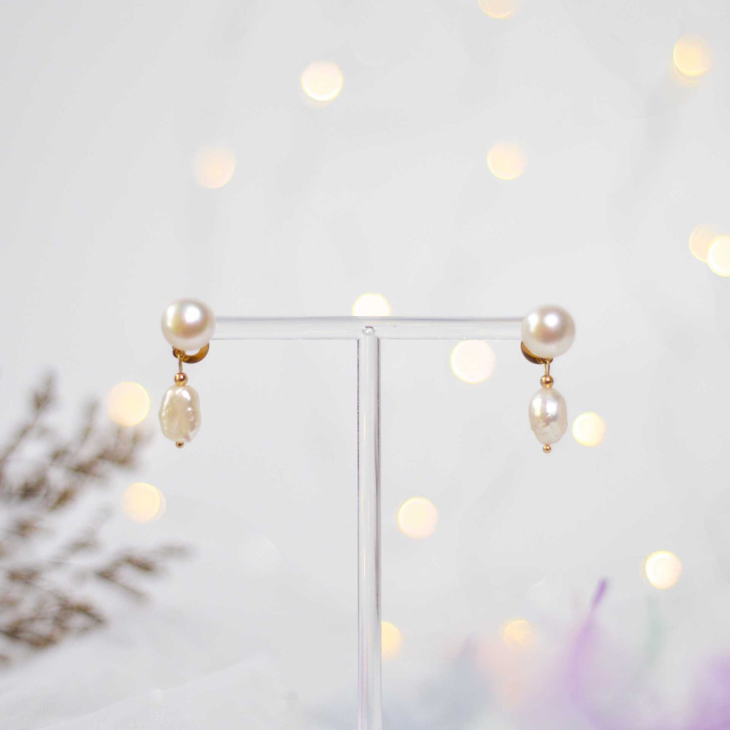 White siopao and baroque dangling pearls yellow gold plated earrings