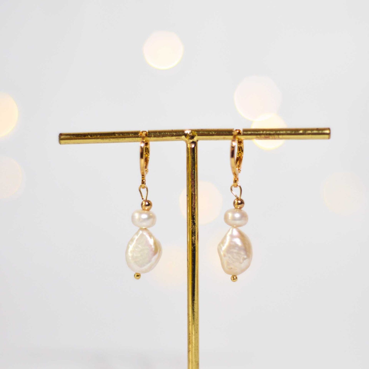 White siopao and baroque dangling pearls yellow gold plated earrings
